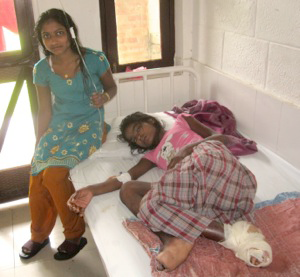 Neelam being watched over by her sister Poonam